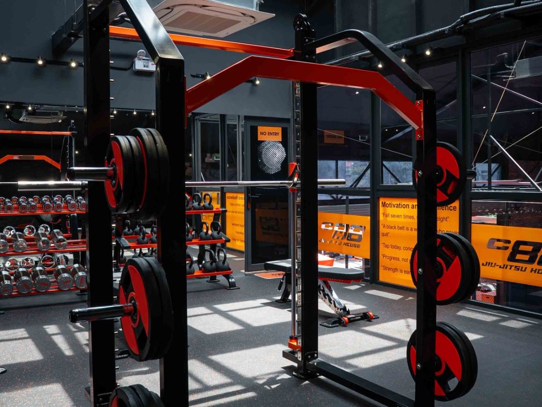 Power rack loaded with weight plates in a commercial gym