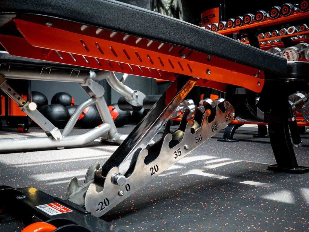 Adjustable weight bench on a commercial gym floor